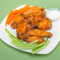 4. Buffalo Wings  · Hand breaded wings tossed in our homemade sauce, served with celery by request and blue chee...