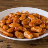 Gigandes · Baked traditional giant beans in tomato sauce, dill, spring onions and extra virgin olive oil