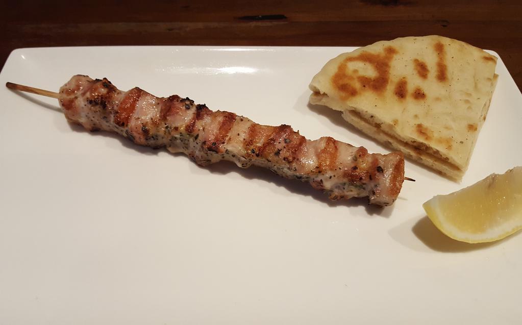 Chicken Stick · Marinated and char-grilled chicken on a stick.