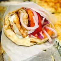 Shrimp Pita Combo · Char-grilled jumbo shrimp. Stuffed with tomatoes, red onions, french fries and choice of sau...