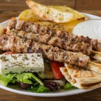 Chicken Sticks Platter · 3 sticks of marinated and char-grilled chicken cubes. Served with Greek salad, warm pita bre...