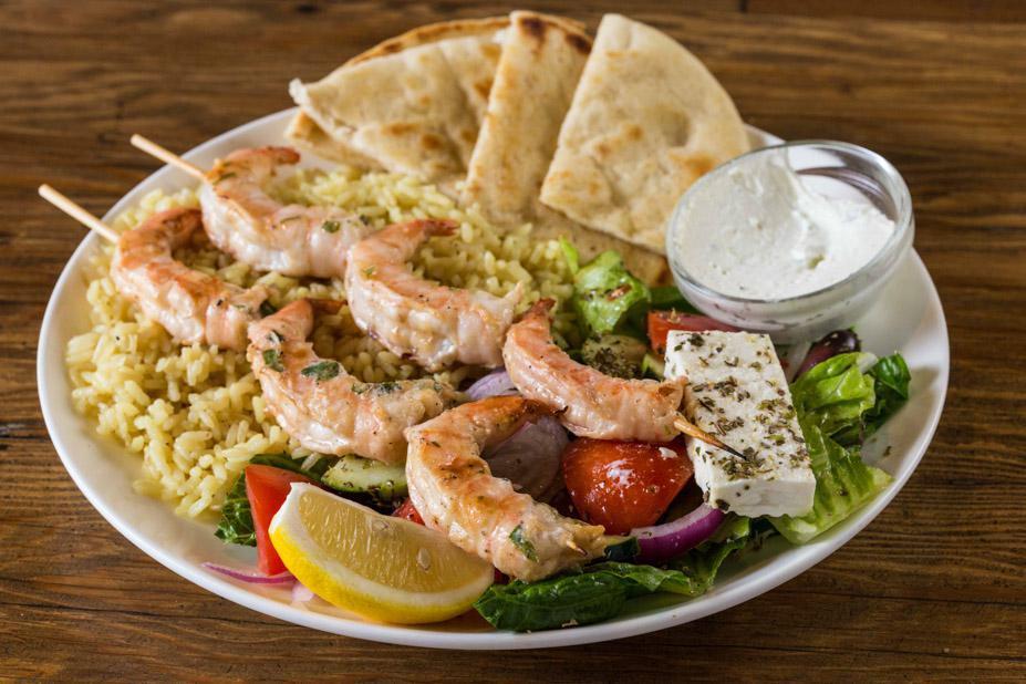 Shrimp Sticks Platter · 2 sticks with marinated and char-grilled shrimp. Served with Greek salad, warm pita bread, choice of sauce and choice of side.