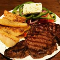16 oz. Black Angus Rib-Eye Steak · Marinated and char-grilled.