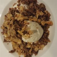 Baklava Crumble · Warm Baklava crumbled over Vanilla Ice Cream