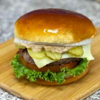 The Legend Burger + Fries · Prime rib steak patty, American cheese, lettuce, tomato, pickles, onions, signature LIT sauc...