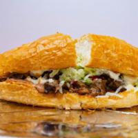 Torta · Your choice of meat on toasted French bread with mayo, refried beans, lettuce, tomato, and g...