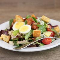 The Cobb Salad · Mixed greens, chicken, bacon, hard boiled egg, cherry tomatoes, avocado, blue cheese and cro...