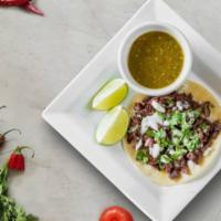 Sabor Carne Asada Taco · Chimichurri marinated beef with guacamole ＆ pico de gallo in soft shell tortilla