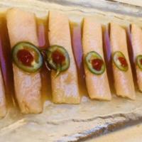 Yellowtail Jalapeno · Slice thinly yellowtail with jalapeno, top with hot sauce and ponzu sauce.
