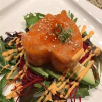 Salmon Tartare · Diced salmon belly, mixed with masago and wasabi mayo, lying on the mixed green, mango, toma...