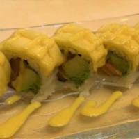 Golden Dragon Roll · 8 pieces. Salmon, avocado inside with mango and mango sauce on the top.