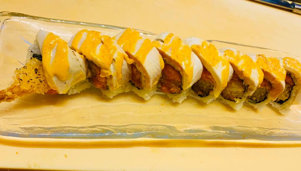 Paradise Roll · 8 pieces. Shrimp tempura, avocado, spicy salmon inside, spicy mayo, seared white tuna and yellowtail on the top.