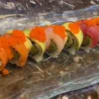 Rainbow Roll · 8 pieces. Kani, cucumber, avocado inside, salmon, tuna, white fish and tobiko on the top.
