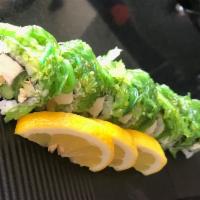 Spicy Green Dragon Roll · 8 pieces. Avocado, cheese, jalapeno and asparagus inside, topped with seaweed salad.