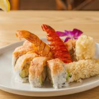 Twin Lobster Roll · 8 pieces. Lobster tempura, avocado and cucumber top with lobster salad and tataki sauce.