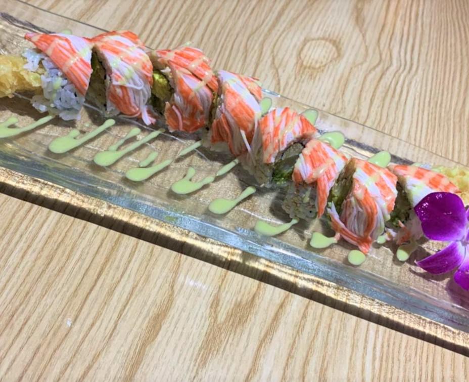 Wasabi  Stinger · 8 pieces. Shrimp tempura and avocado inside, top with каni and wasabi sauce