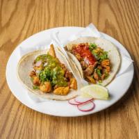 Roasted Chicken Taco · served with onion and cilantro 