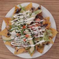 Nachos · Mexican cheese, Mexican sour cream, pico de gallo, guacamole, and black beans, No meat