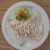 Chicken quesadilla · Flour quesadilla served with sour cream, mexican cheese and house salad 