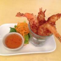 7. Coconut Shrimp · 4 pieces. Shrimp with a sweet coconut and almond breading served with sweet dipping.