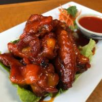 11. Spicy Chicken Wings · Grilled chicken wings with Thai spicy sauce.