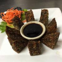 18. Chive Pancake · Chive patty, pan fried for outside crunch and served with spicy sweet soy sauce.