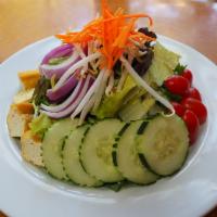21. Thai Salad · Salad that is made with romaine, tomato, cucumber, bean sprouts, tofu and pair with house pe...