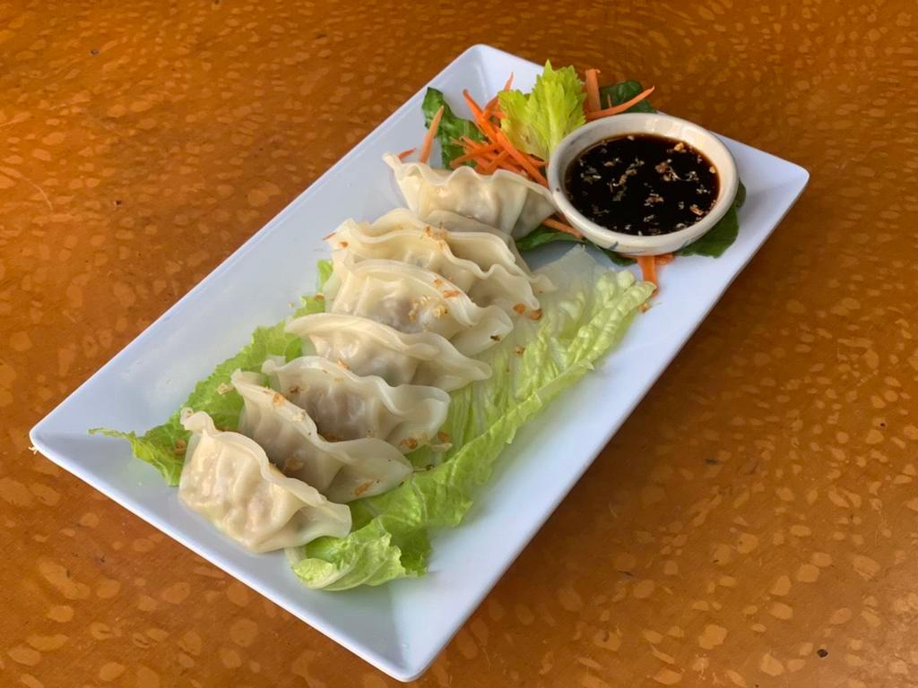 16. Steamed Veg Dumplings · 4 pieces. In house dumplings made with broccoli, carrot, mushroom, sliced bamboo shoot side with spicy soy sauce.