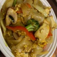 34. Singapore Noodles · Stir fried flat noodles fused with yellow curry powder and mixed with onions, scallions, bea...