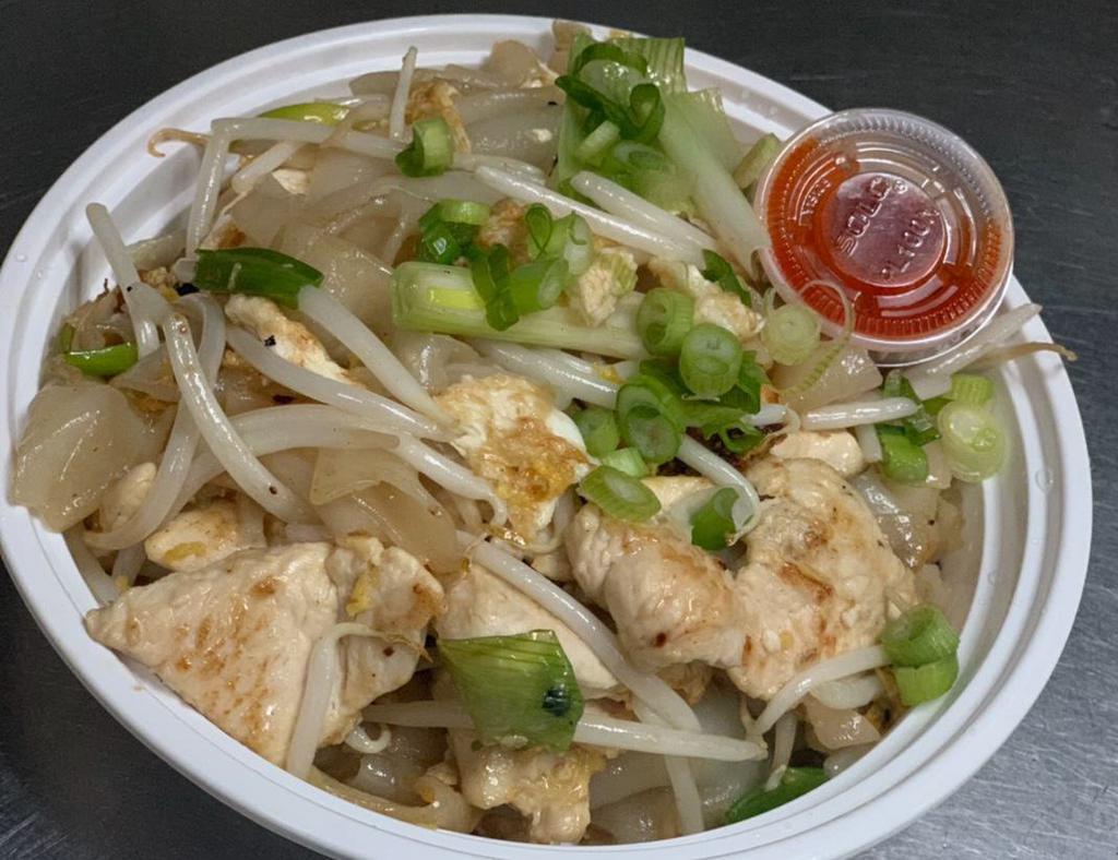 39. Pad Gai Kua · Sauteed flat noodles, bean sprouts, romaine, scallions and onions served with Sriracha sauce.