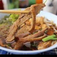 40. Duck Noodle Soup · Duck broth noodle soup with Asian broccoli, scallions and fried onion with choice of thin no...