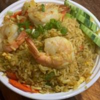 49. Pineapple  Fried Rice · Sweetness of pineapple is added with egg, onions, cashew nuts, tomato, curry powder and scal...