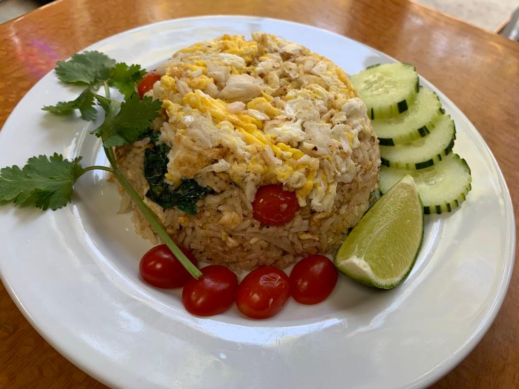 53. Crab Meat Fried Rice · Thai style fried rice with tomato, egg, onions, Chinese broccoli, scallions and lump crabmeat.