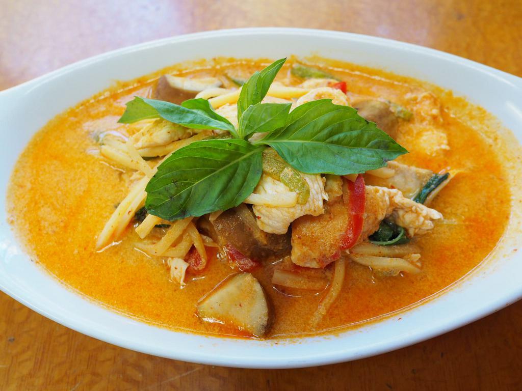 54. Red Curry · Smooth creamy coconut milk is matched with hot fiery chili paste, eggplant, bamboo shoot, basil and bell pepper.served with jasmine rice