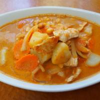 56. Massaman Curry · Milder curry with coconut milk, onions, potato, carrots and peanuts for a rich creamy taste....