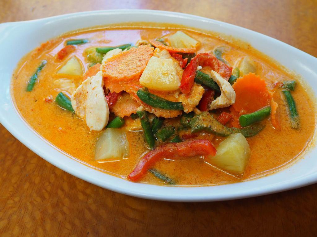 57. Panang Curry · Lightly sweet and spicy with pineapple, string beans, carrots and lime leaves.served with jasmine rice