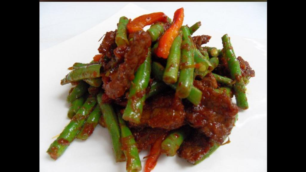 62. Pad Prik Khing · Favorite of the spicy food lover using prik khing curry paste, string beans, carrots and kaffir lime leaves.served with jasmine rice