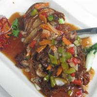 73. Duck Tamarind · Among the favorite is this roasted duck with tamarind spicy sauce with steamed vegetables.se...