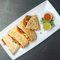 KFC Quesadillas · Pan fried Quesadilla filled with Fried Chicken, jalapenos, caramelized onions, cheese, kimch...