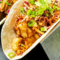 Tofu BBQ Taco · Fried tofu coated in our BBQ sauce. Topped with our Asian slaw, peanuts, TaKorea greens, and...