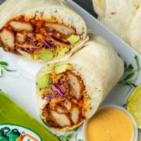 Fried Chicken Burrito · Korean-style twice Fried Chicken.  Wrapped with our Cilantro-Lime Rice, Queso,  Avocado, and...