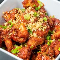 Korean Fried Chicken · Crispy double-fried chicken coated with spicy Korean sauce, topped with crushed peanuts, whi...