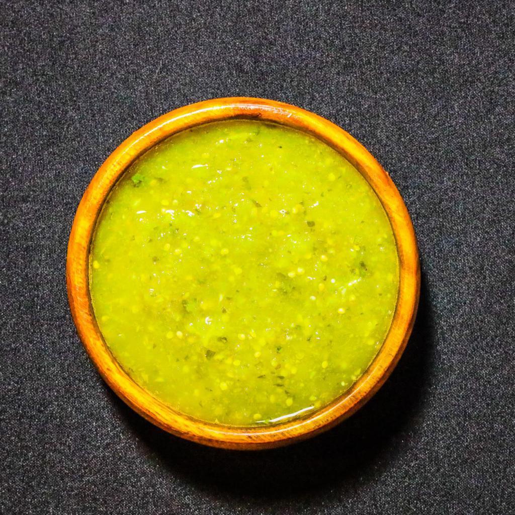 Salsa Verde · Blend of tomatillos, jalapenos, lime, yuzu juice, cilantro, and various spices. Housemade. 2 oz.
