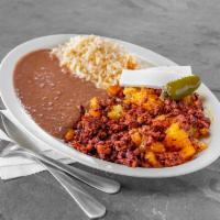 Papas con Chorizo · Fried potatoes and chorizo. Served with a side of rice, beans, queso fresco and handmade tor...