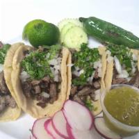 Tacos  · Freshly cooked meat, handmade tortillas and topped with cilantro and onion. 