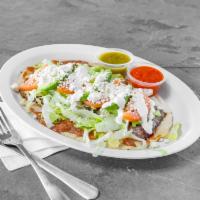 Huarache · A Mexican memela with beans, your choice of meat and topped with Lettuce, tomatoes, avocado,...