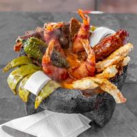 Molcajete · Try our traditional molcajete, a combination of carne asada, pollo asado, chorizo, bacon wra...