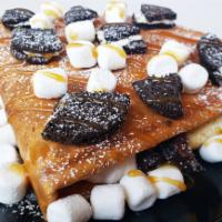 Oreo & Mashmellows  · A delicious Oreo and marshmallow crepe. Topped with Nutella, Caramel and powder sugar. 