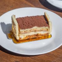 Tiramisu Cake · Coffee flavored cake layered with mascarpone, chocolate coated ladyfingers, and cocoa.