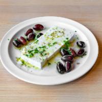 Feta and Olives · Thick Sliced Feta cheese served with black kalamata olives and a drizzle of olive oil
*GF* ...